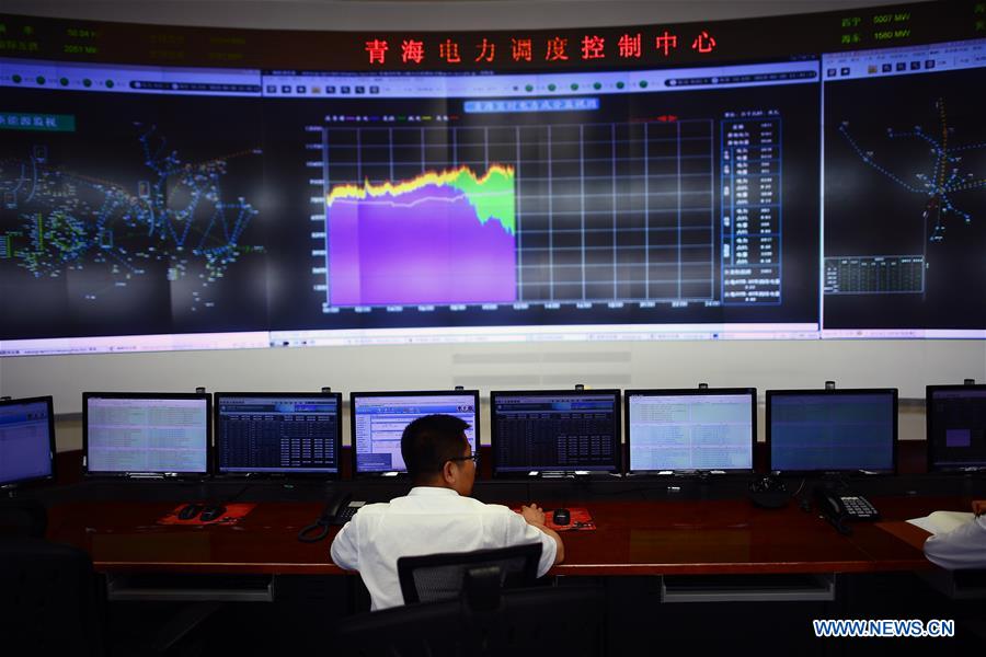 A staff member monitors new energy power supply data at the State Grid Qinghai Electric Power Company in Xining, northwest China's Qinghai Province, June 20, 2018