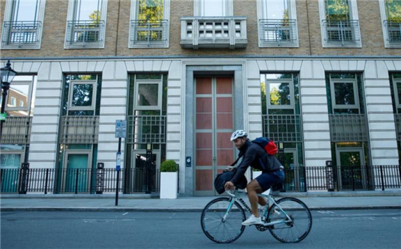 A cyclist passes the headquarters of BP Plc in London. Photographer: Luke MacGregor/Bloomberg